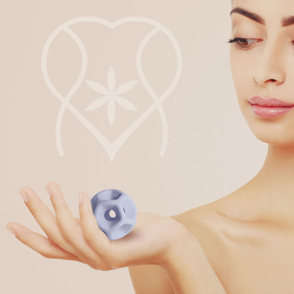 Woman Soma Flex 40 in her palm with the body safe logo in the background