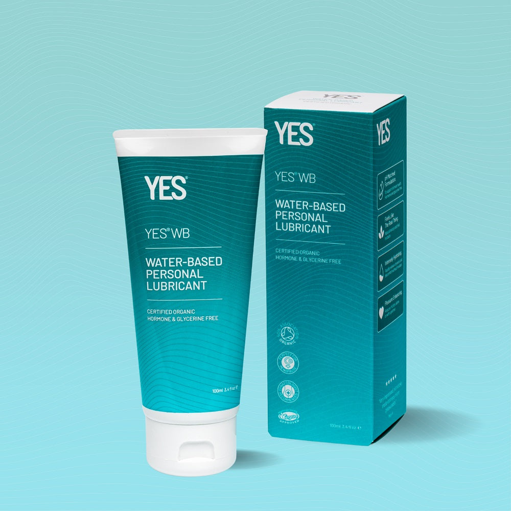Tube and box of YES water-based personal lubricant on a light blue background