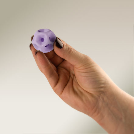 Hand holding a Soma Flex® 35 against a plain background