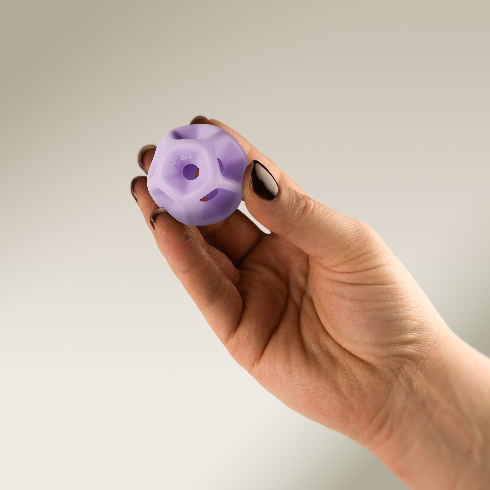 Hand holding a Soma Flex® 40 against a plain background