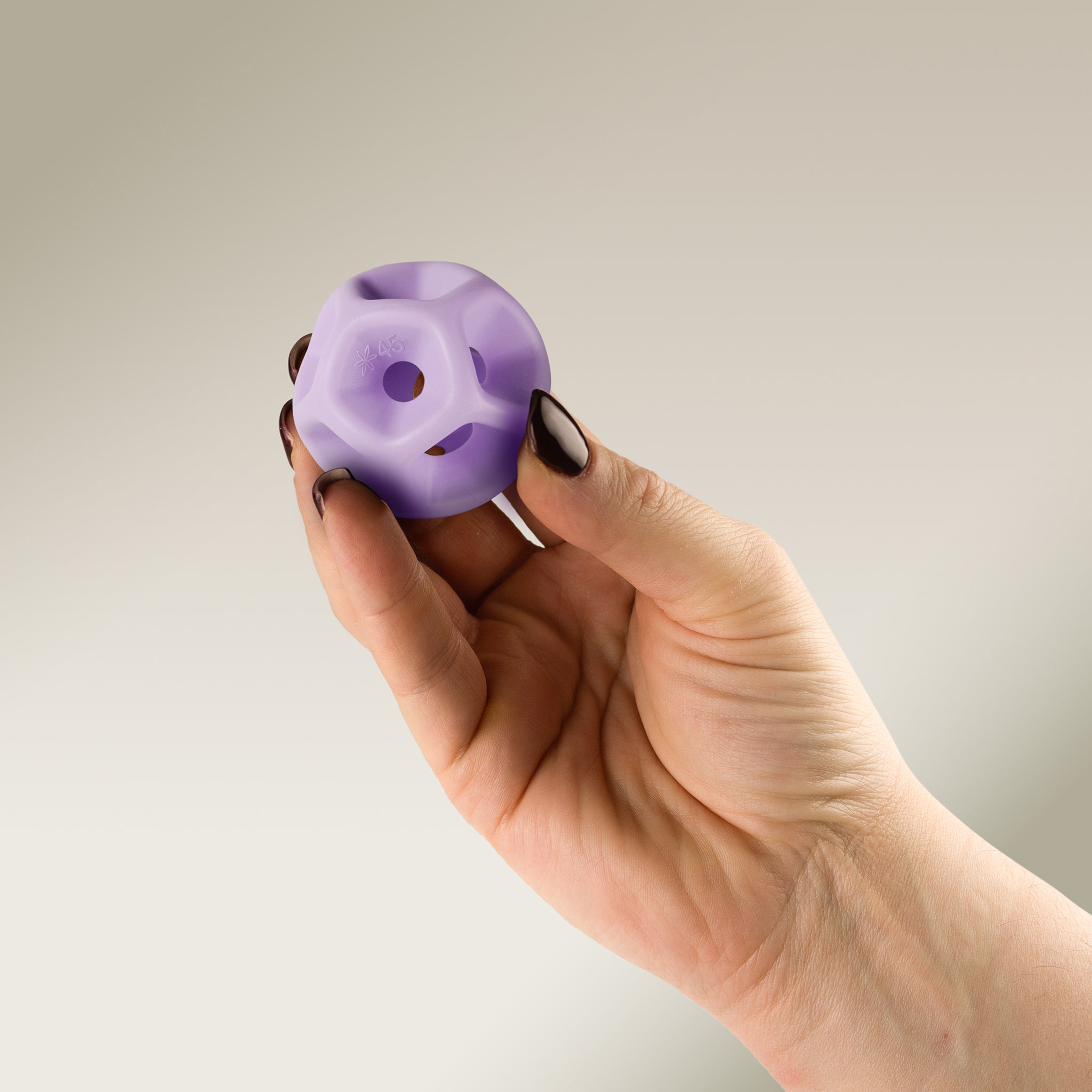 Hand holding a Soma Flex® 45 against a plain background